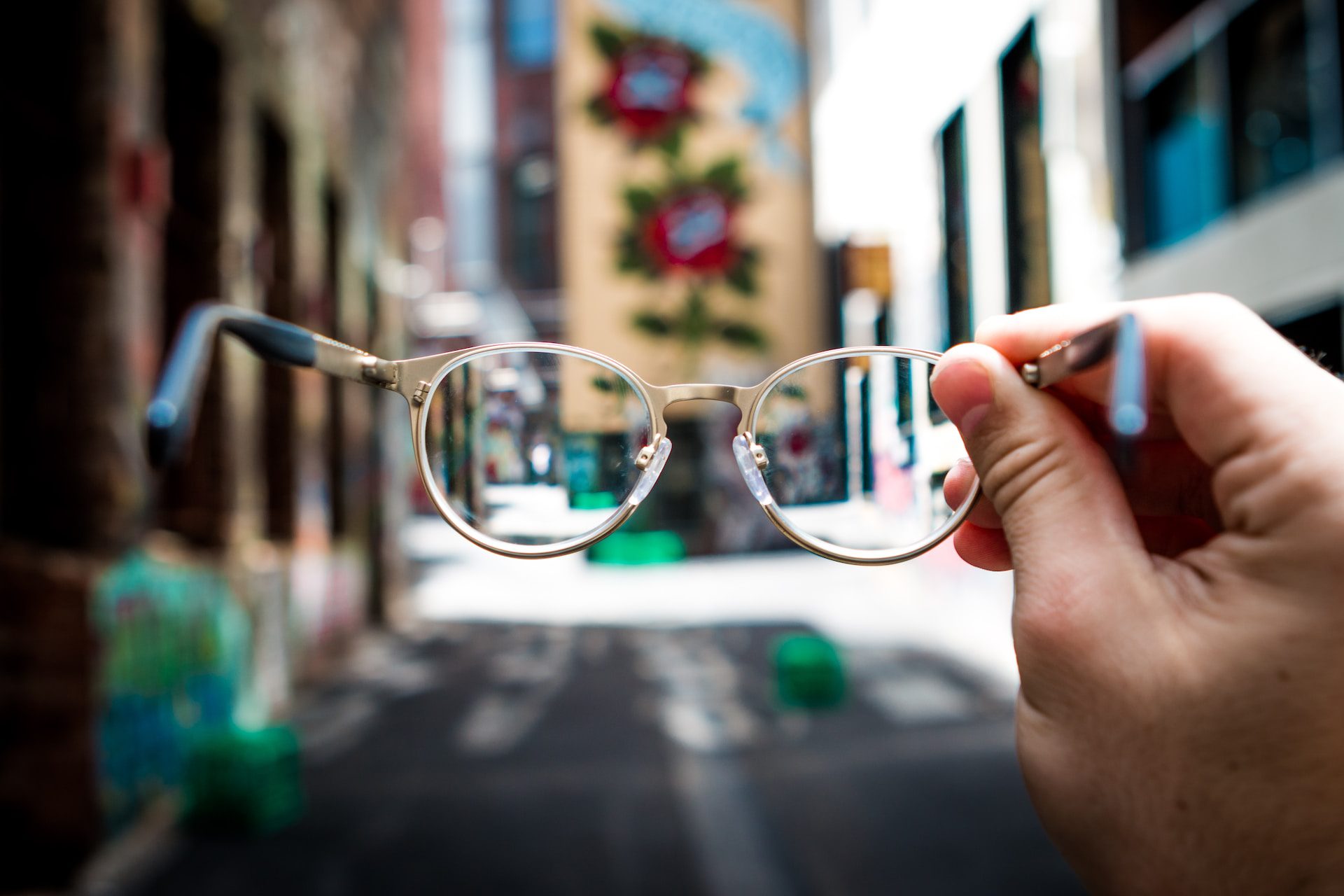 a clear pair of glasses held in front of the camera