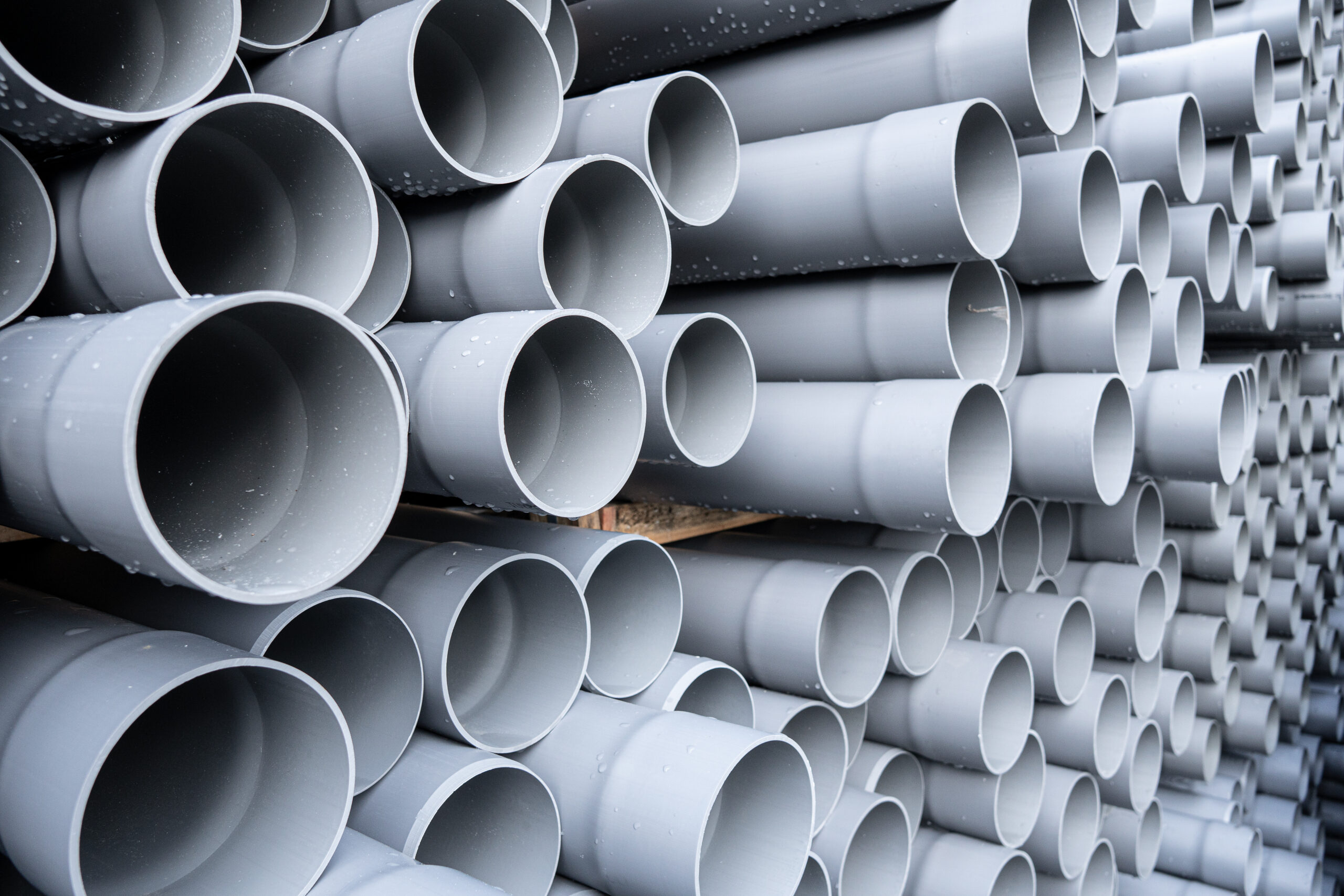 A collection of fabricated PVC pipes holding hoses