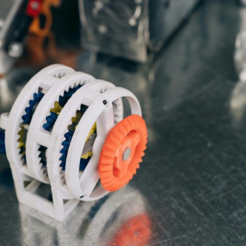 Close-up of a 3D-printed classic gear assembly with interlocking components.