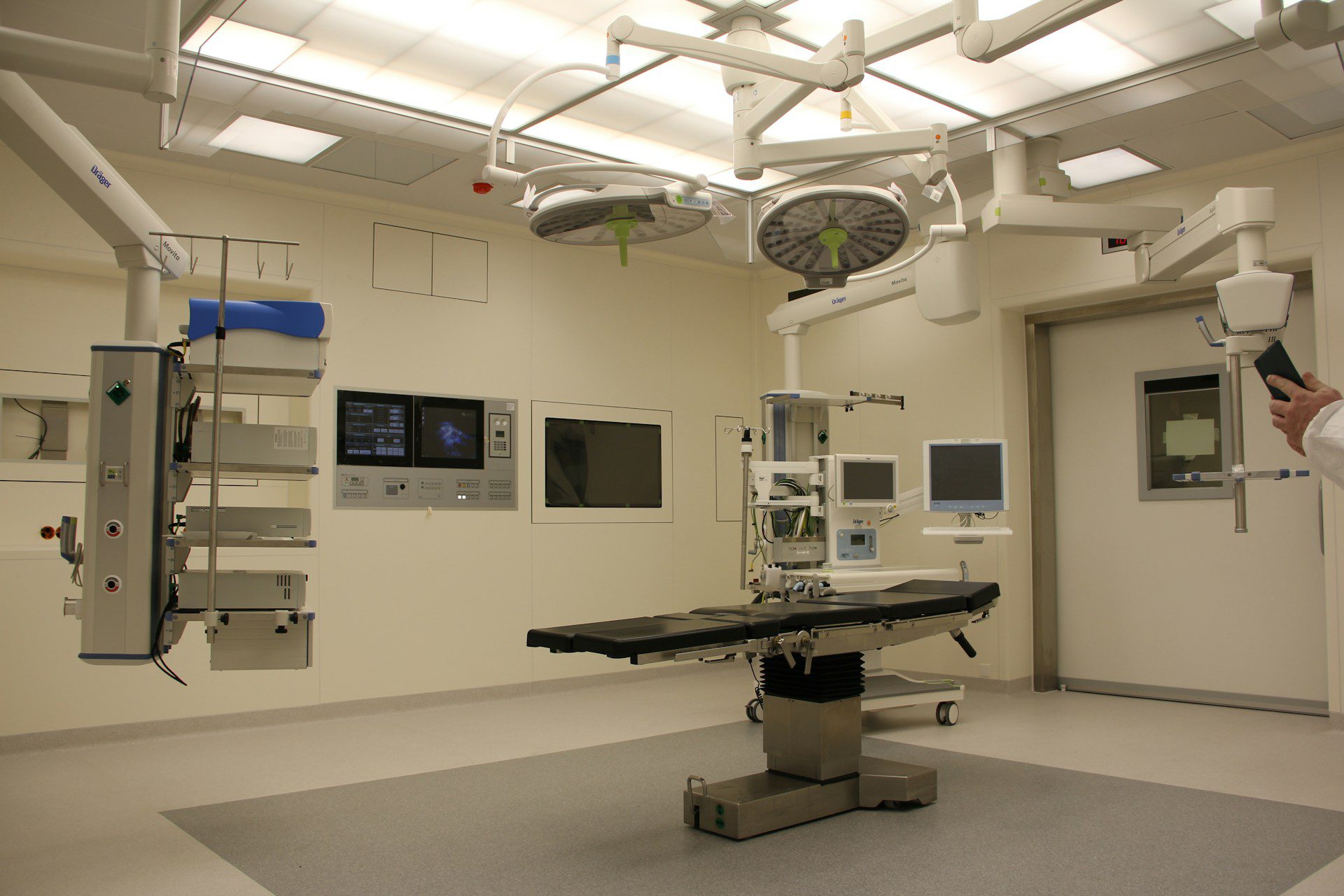 Modern hospital operating with surgical lights, monitors, and medical equipment, made from medical-grade plastic